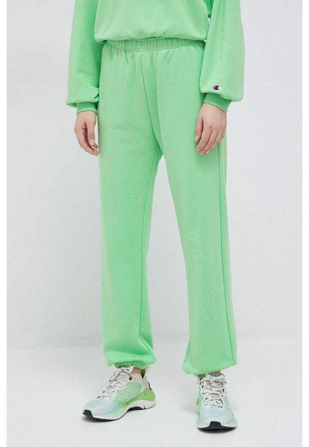 Champion spodnie dresowe kolor zielony gładkie. Kolor: zielony. Materiał: dresówka. Wzór: gładki