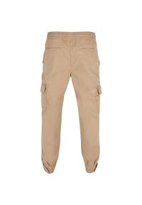 Urban Classics - Męskie Spodnie Do Biegania. Kolor: beżowy. Długość: długie