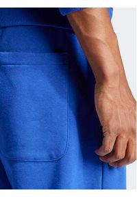 Adidas - adidas Spodnie dresowe ALL SZN IW1186 Niebieski Regular Fit. Kolor: niebieski. Materiał: bawełna