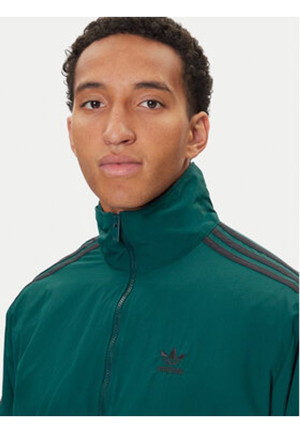 Adidas - adidas Bluza adicolor Woven Firebird JY1329 Zielony Loose Fit. Kolor: zielony. Materiał: syntetyk
