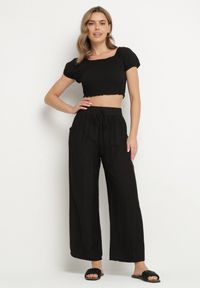 Born2be - Czarne Szerokie Spodnie Palazzo z Wysokim Stanem i Wiązaniem Myrlevia. Okazja: na co dzień. Stan: podwyższony. Kolor: czarny. Styl: klasyczny, elegancki, casual #7