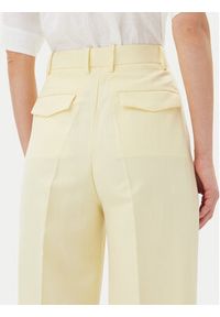 TOMMY HILFIGER - Tommy Hilfiger Spodnie materiałowe WW0WW45460 Żółty Relaxed Fit. Kolor: żółty. Materiał: len
