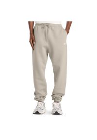 Spodnie męskie New Balance MP41503TWF - beżowe. Kolor: beżowy. Materiał: poliester, bawełna, materiał, dresówka #1