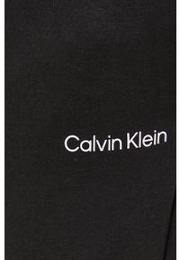 Calvin Klein spodnie męskie kolor czarny gładkie. Kolor: czarny. Wzór: gładki