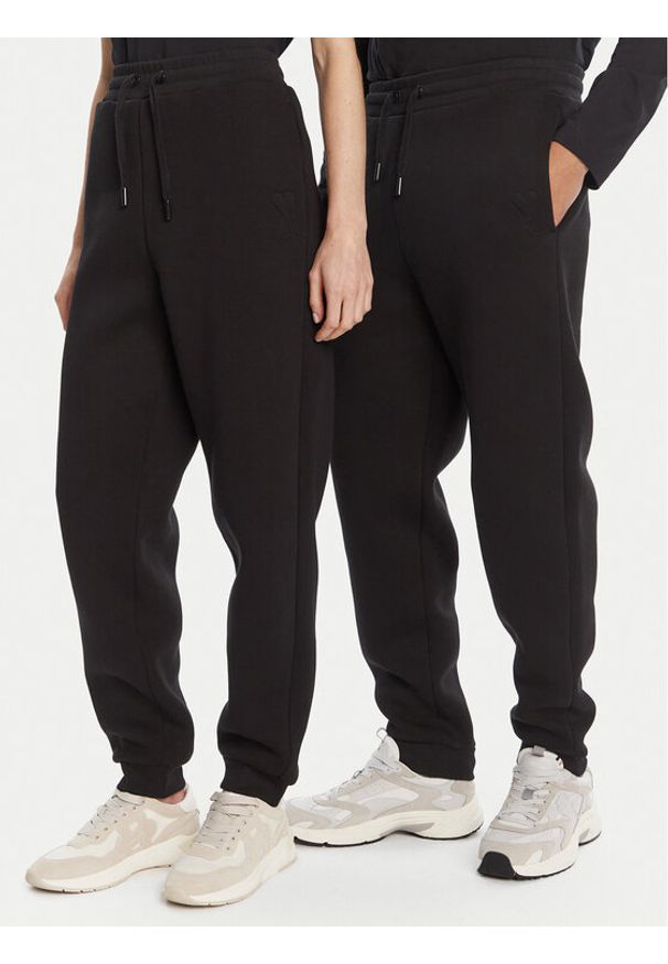 AMI PARIS - AMI Paris Spodnie dresowe UTR237.749 Czarny Relaxed Fit. Kolor: czarny. Materiał: bawełna, syntetyk