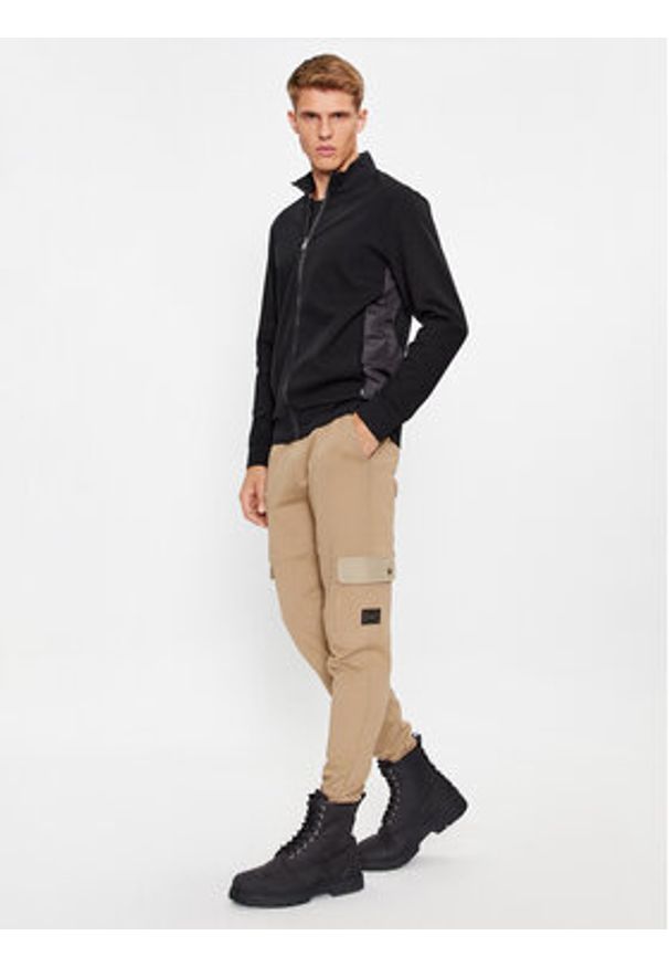 Hugo Spodnie dresowe 50493044 Beżowy Relaxed Fit. Kolor: beżowy. Materiał: bawełna