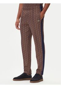 Lacoste Spodnie dresowe XH1440 Brązowy Regular Fit. Kolor: brązowy. Materiał: bawełna
