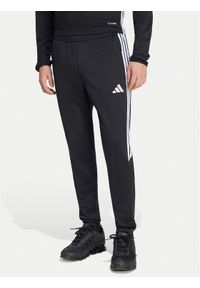 Adidas - adidas Spodnie dresowe Tiro 25 Essentials Training KG0809 Czarny Regular Fit. Kolor: czarny. Materiał: syntetyk #1