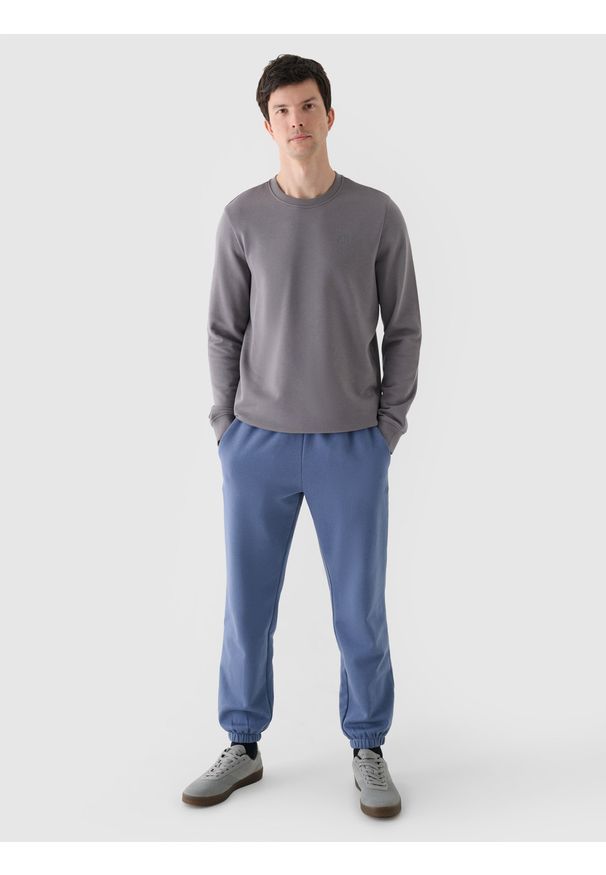 4f - 4F Spodnie dresowe joggery męskie - niebieskie XL. Kolor: niebieski. Materiał: dresówka. Wzór: gładki, ze splotem