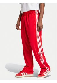 Adidas - adidas Spodnie dresowe Adibreak IY9924 Czerwony Loose Fit. Kolor: czerwony. Materiał: syntetyk