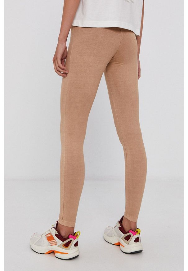 Reebok Classic Legginsy damskie kolor beżowy gładkie. Stan: podwyższony. Kolor: beżowy. Wzór: gładki