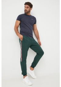 TOMMY HILFIGER - Tommy Hilfiger spodnie dresowe męskie kolor zielony z aplikacją. Kolor: zielony. Materiał: dresówka. Wzór: aplikacja #4