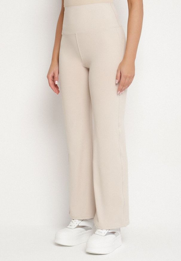Born2be - Beżowe Legginsy Dzwony z Wysokim Stanem i Szeroką Gumką w Talii Idoreia. Okazja: na co dzień. Stan: podwyższony. Kolor: beżowy. Styl: elegancki, casual