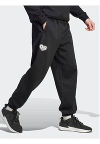 Adidas - adidas Spodnie dresowe HY1288 Czarny Loose Fit. Kolor: czarny. Materiał: dresówka, bawełna #4
