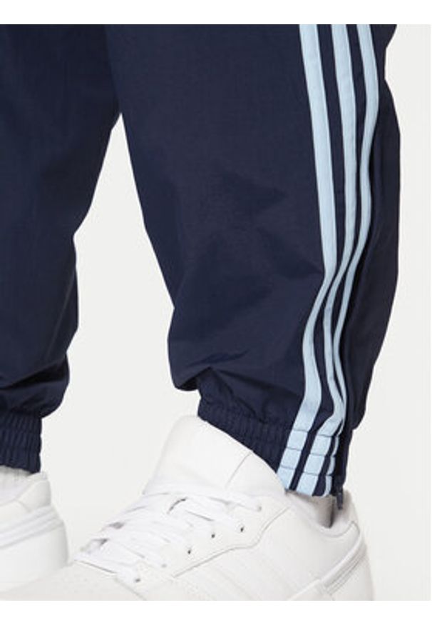 Adidas - adidas Spodnie dresowe adicolor Firebird JP1249 Granatowy Regular Fit. Kolor: niebieski. Materiał: syntetyk