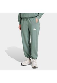 Adidas - Spodnie polarowe z efektem sprania ADIDAS ALL SZN. Kolor: zielony. Materiał: polar. Wzór: paski #1