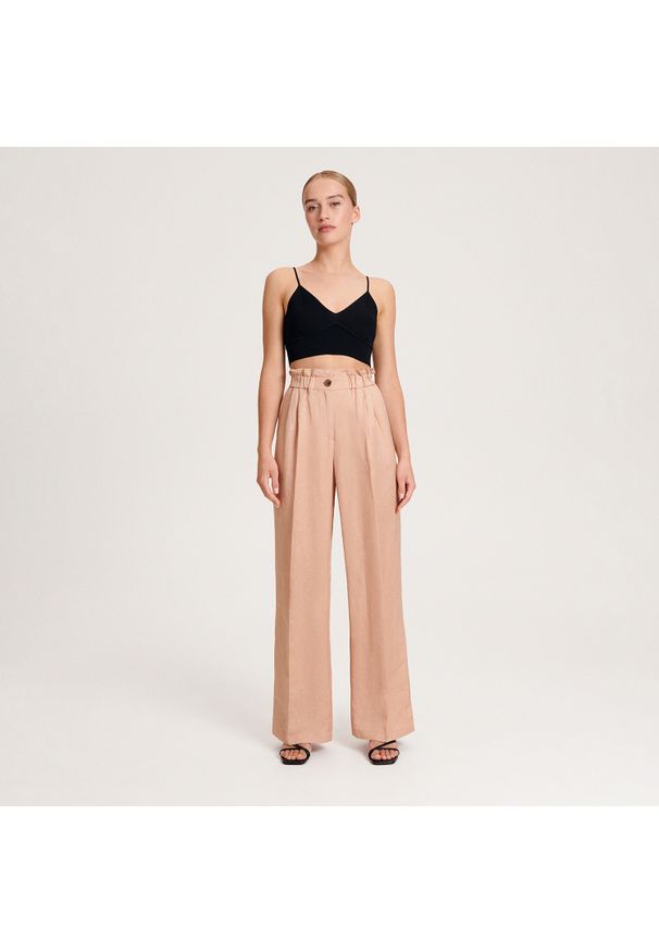 Reserved - Spodnie z lnem - Różowy. Kolor: różowy. Materiał: len