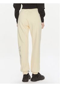 Calvin Klein Jeans Spodnie dresowe Bold Monologo J20J222606 Żółty Relaxed Fit. Kolor: żółty. Materiał: bawełna