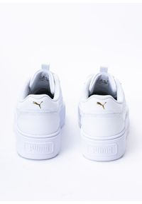 Sneakersy damskie białe Puma Karmen Rebelle. Zapięcie: pasek. Kolor: biały. Materiał: guma, materiał. Szerokość cholewki: normalna. Obcas: na platformie