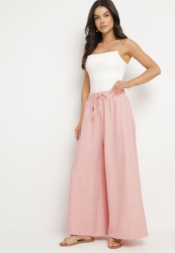 Born2be - Różowe Spodnie o Szerokim Kroju z Wysokim Stanem i Wiązaniem Telarieta. Okazja: na co dzień. Stan: podwyższony. Kolor: różowy. Materiał: len. Styl: elegancki, klasyczny, casual