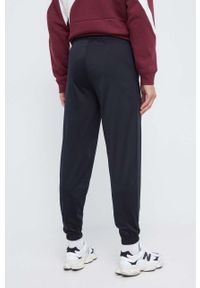 Reebok spodnie dresowe kolor czarny gładkie. Kolor: czarny. Materiał: dresówka. Wzór: gładki #4