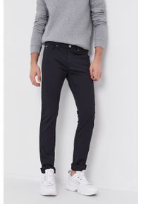 Emporio Armani spodnie męskie kolor granatowy dopasowane. Kolor: niebieski. Materiał: tkanina. Wzór: gładki #1