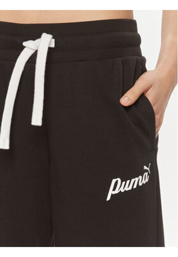 Puma Spodnie dresowe Ess+ Script 679350 Czarny Regular Fit. Kolor: czarny. Materiał: syntetyk, bawełna