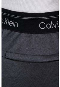 Calvin Klein Performance spodnie treningowe kolor szary melanżowe. Stan: podwyższony. Kolor: szary. Wzór: melanż #3