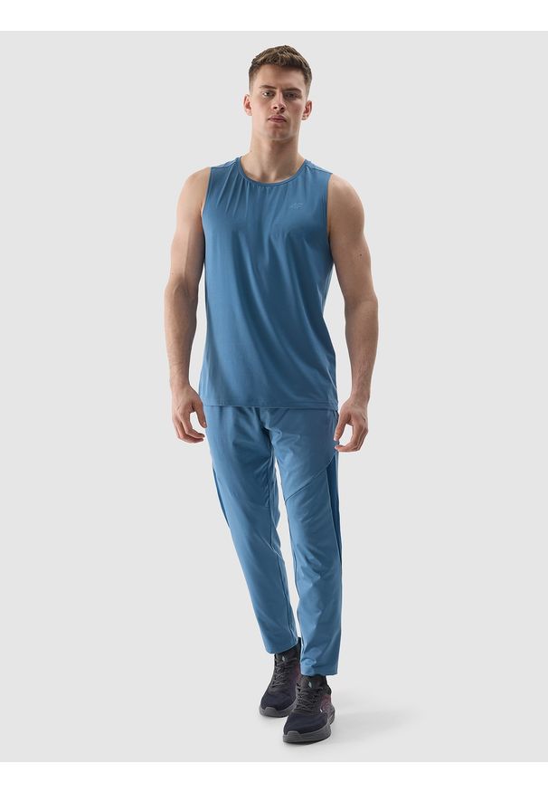 4f - 4F Spodnie treningowe szybkoschnące męskie - niebieskie 3XL. Kolor: niebieski. Materiał: włókno, elastan, dzianina, materiał, syntetyk. Wzór: ze splotem. Sport: fitness