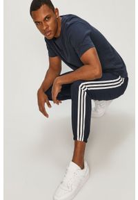 Adidas - adidas - Spodnie. Kolor: niebieski. Materiał: tkanina, poliester. Wzór: gładki #1