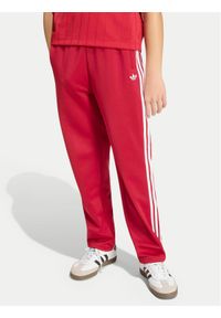 Adidas - adidas Spodnie dresowe Firebird HZ6651 Czerwony Regular Fit. Kolor: czerwony. Materiał: syntetyk #1