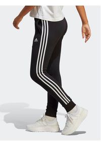 Adidas - adidas Spodnie dresowe Essentials 3-Stripes French Terry Cuffed Joggers IC8770 Czarny Slim Fit. Kolor: czarny. Materiał: bawełna #6