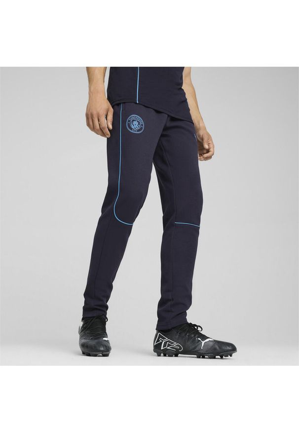 Puma - Męskie spodnie Casuals Manchester City PUMA New Navy Magic Blue. Kolor: niebieski. Sport: piłka nożna