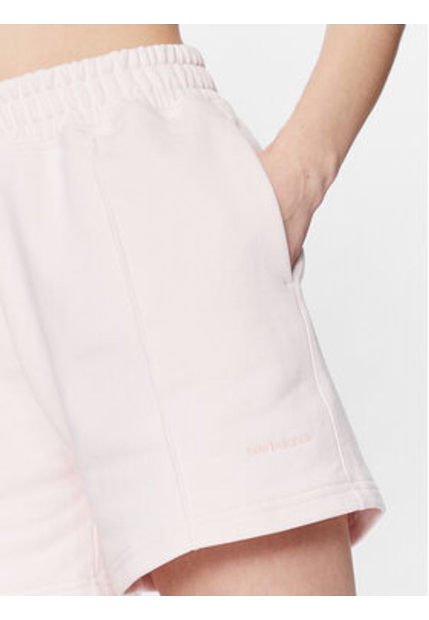 New Balance Szorty sportowe WS23552 Różowy Relaxed Fit. Kolor: różowy. Materiał: bawełna