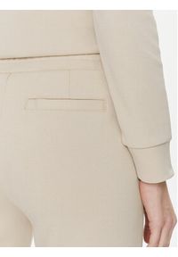 Calvin Klein Spodnie dresowe Micro Logo Essential K20K204424 Beżowy Slim Fit. Kolor: beżowy. Materiał: dresówka, bawełna