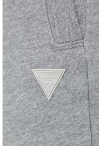 Guess spodnie dresowe kolor szary melanżowe. Kolor: szary. Materiał: dresówka. Wzór: melanż #4
