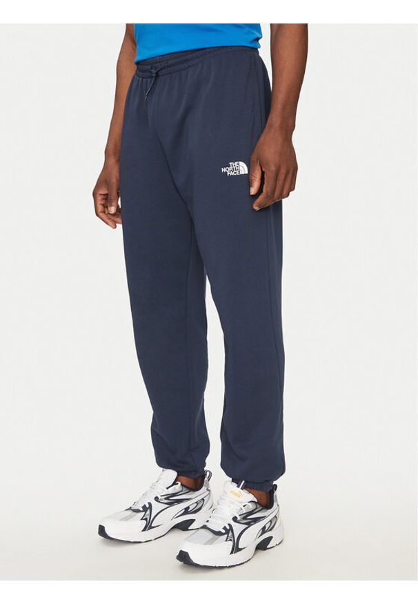 The North Face Spodnie dresowe Simple Dome Light NF0A8C41 Granatowy Regular Fit. Kolor: niebieski. Materiał: syntetyk, bawełna