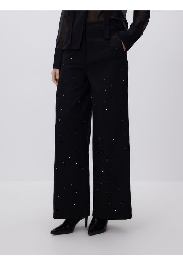 Reserved - Spodnie ze strasem - czarny. Kolor: czarny. Materiał: wiskoza, tkanina