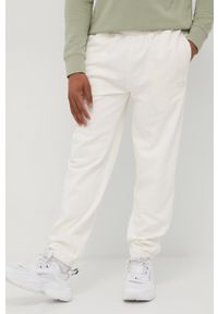 Lee spodnie męskie kolor beżowy gładkie. Kolor: beżowy. Materiał: dzianina. Wzór: gładki