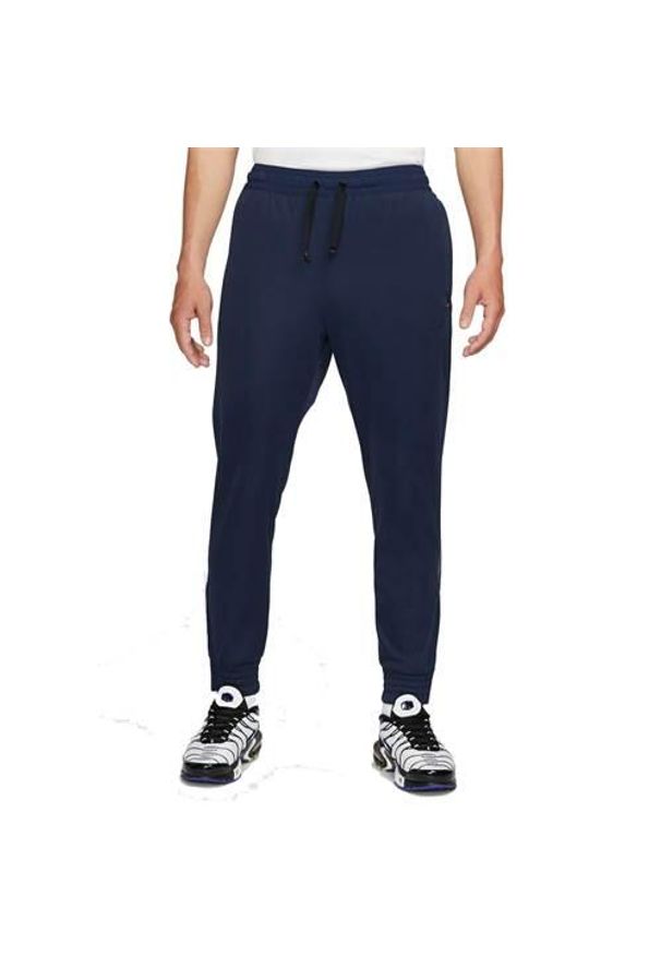 Spodnie sportowe męskie Nike FC. Kolor: niebieski. Materiał: dresówka. Długość: długie