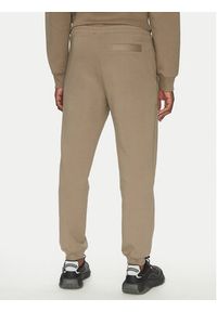 Hugo - HUGO Spodnie dresowe Dimacs 50533695 Brązowy Relaxed Fit. Kolor: brązowy. Materiał: bawełna #3