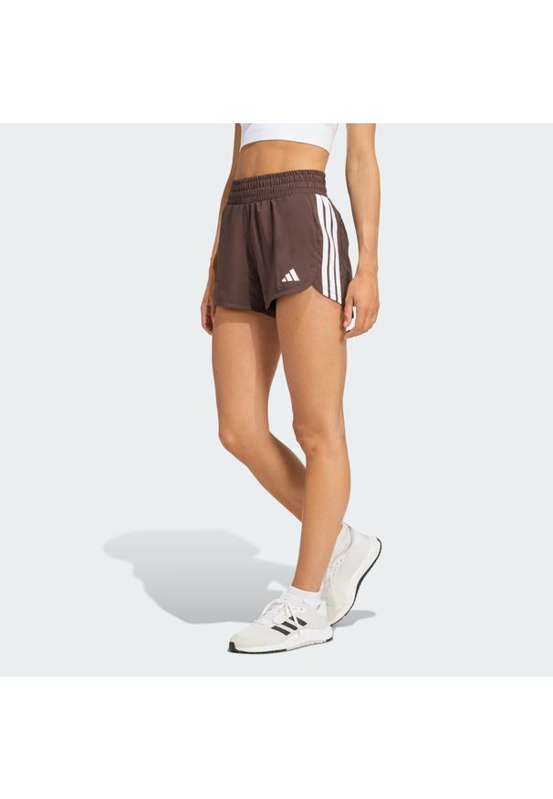 Adidas - Szorty treningowe Pacer Workout Woven High Rise. Kolor: brązowy, biały, wielokolorowy. Technologia: ClimaCool (Adidas). Sport: fitness