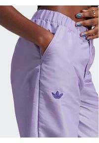 Adidas - adidas Spodnie dresowe Wide Leg Tracksuit Bottoms IC5443 Fioletowy. Kolor: fioletowy. Materiał: syntetyk