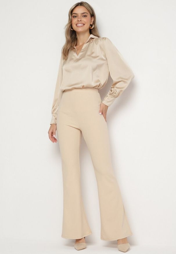Born2be - Beżowe Spodnie Dzwony z Gumką w Pasie Milica. Okazja: na co dzień. Stan: podwyższony. Kolor: beżowy. Materiał: wiskoza. Styl: casual, elegancki