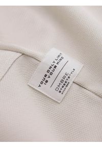 Ombre Clothing - Męskie spodnie dresowe ze strukturalnej dzianiny - jasnobeżowe V1 - Rozmiar: L. Kolor: beżowy. Materiał: dresówka, dzianina. Wzór: melanż, aplikacja, ze splotem. Styl: elegancki