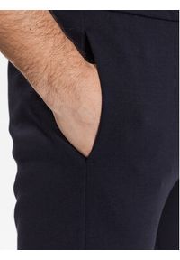 Calvin Klein Spodnie dresowe Micro Logo K10K109940 Granatowy Regular Fit. Kolor: niebieski. Materiał: bawełna, dresówka #4
