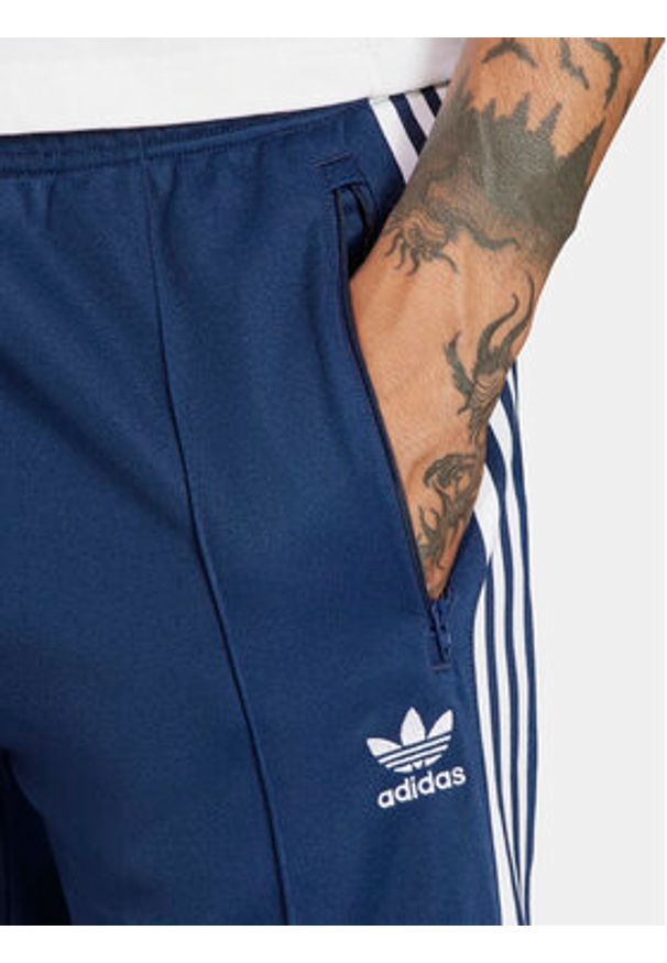 Adidas - adidas Spodnie dresowe adicolor Classics Beckenbauer IP0421 Niebieski Slim Fit. Kolor: niebieski. Materiał: syntetyk, bawełna