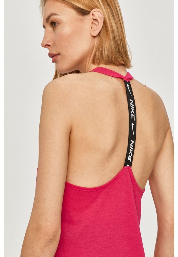 Nike - Top. Kolor: różowy. Materiał: tkanina, dzianina, skóra, włókno