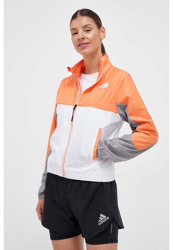 The North Face wiatrówka Mountain Athletics kolor pomarańczowy. Kolor: pomarańczowy. Materiał: materiał