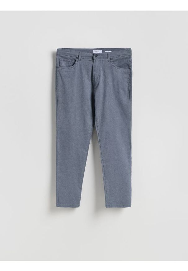 Reserved - Bawełniane spodnie slim fit - granatowy. Kolor: niebieski. Materiał: bawełna